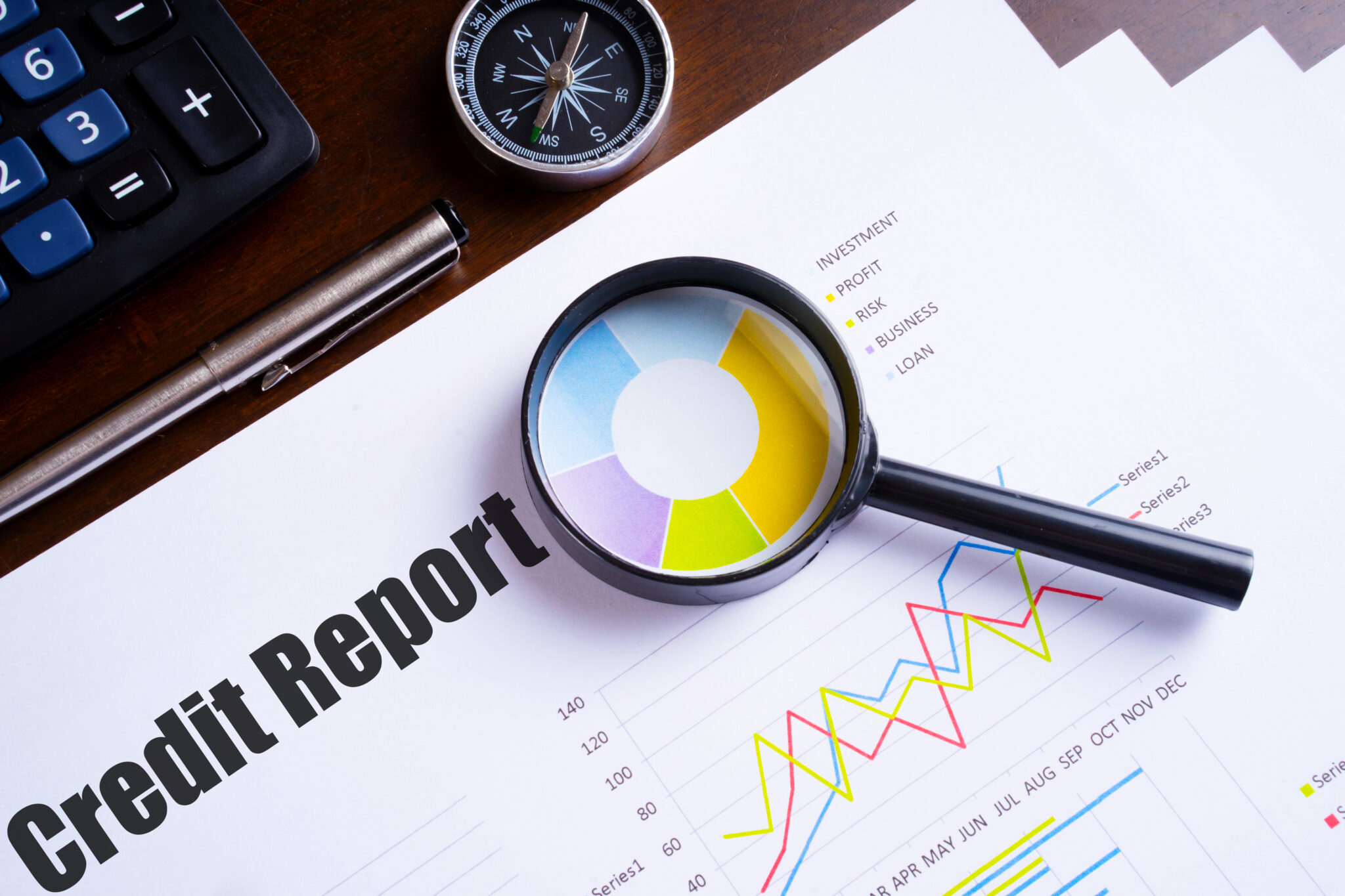 Magnifying,Glass,On,Colourful,Pie,Chart,With,"credit,Report",Text